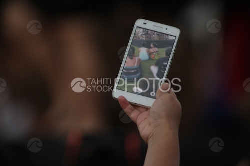 Smartphone in hand taking pictures