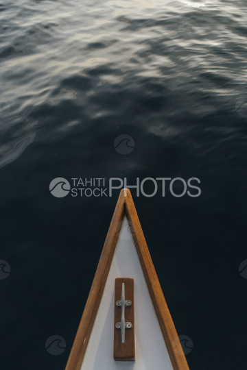 BORA BORA, front of TRADITIONAL POLYNESIAN OUTRIGGER on the lagoon