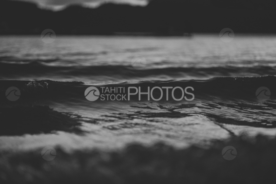Lagoon of BORA BORA, SHORE ON THE BEACH AND SMALL WAVES at sunset